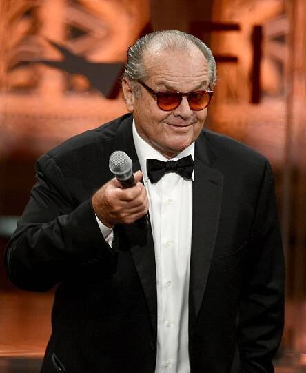 This image may contain Tie Accessories Accessory Clothing Suit Coat Overcoat Apparel Jack Nicholson and Sunglasses