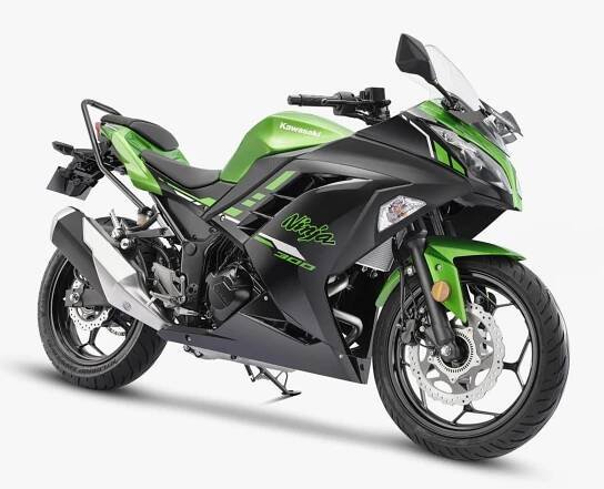 Green and black Kawasaki Ninja 300 sport motorcycle with aerodynamic fairings, front disc brakes, and a sleek, sporty design.