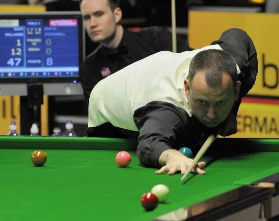 Mark Williams playing a shot