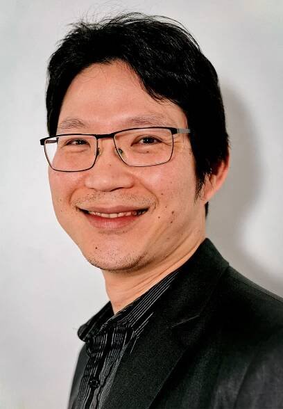 Danupon Nanongkai wears black with a white background