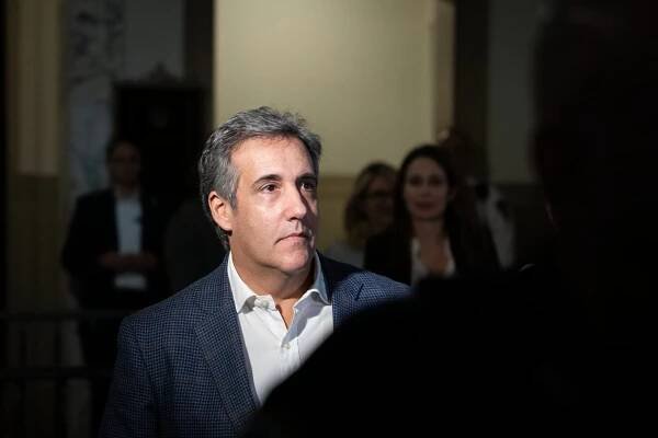 Michael D. Cohen, in a blue jacket and light shirt, in court.