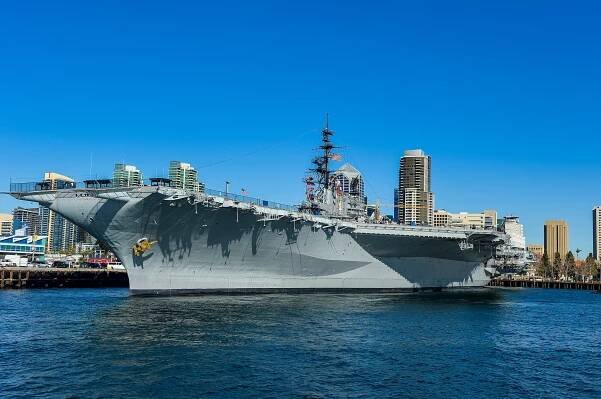 The gray hulk of the USS Midway sits in the water at Navy Pier.