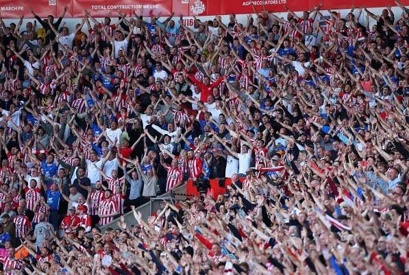 Sunderland fans cheering in the stands.