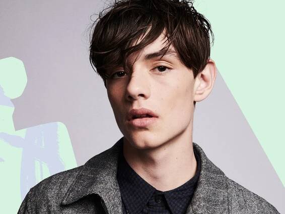 Enola Holmes' Louis Partridge On Millie Bobby Brown & More