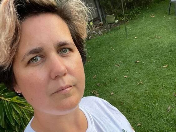 Selfie of Megan Maurice, with short hair, closed mouth smile and tshirt with line: If you hate Pat Cummings, I hate you.