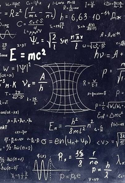 a blackboard with many calculations written on it and some writing on the back ground