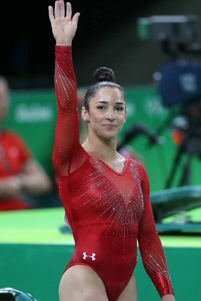 Olympics: Day 6 Alexandra Raisman #395 of the United States reacts to her Floor Exercise score during her silver medal performance in the Artistic Gymnastics Women's Individual All-Around Final at the Rio Olympic Arena on August 11, 2016
