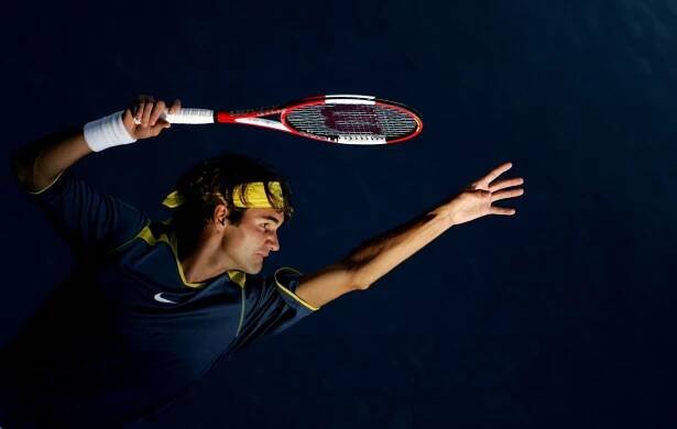Roger Federer serves to Andre Agassi during the men's final at the U.S. Open tennis tournament.