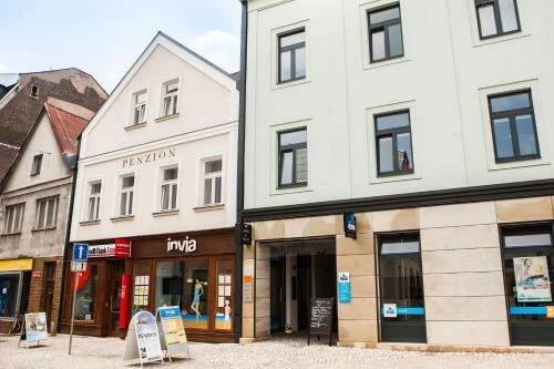 a row of buildings on a street at Penzion Na Náměstí in Dvůr Králové nad Labem