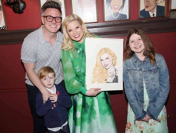 Megan Hilty, Brian Gallagher, son Ronan Gallagher and daughter Viola Gallagher pose as Hilty receives her caricature in honor of her performance in 