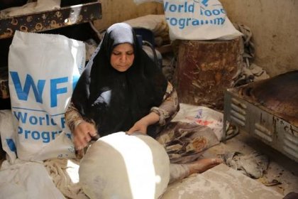 woman bread syria