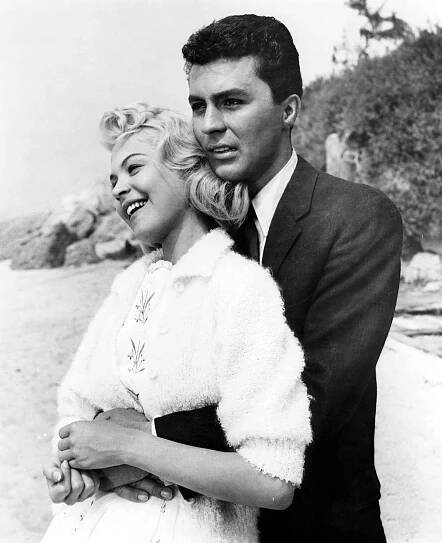 Sandra Dee is held by James Darren in a scene from the film Gidget in 1959