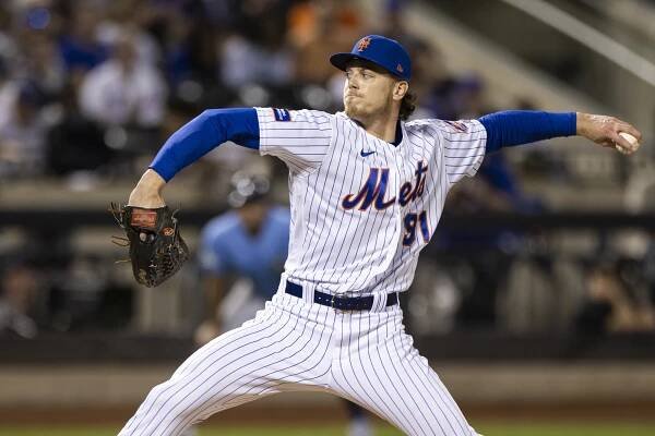 Josh Walker throws a pitch in the seventh inning against the Tampa Bay Rays.