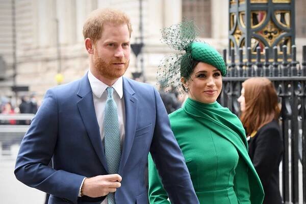 Image may contain Prince Harry Clothing Apparel Tie Accessories Accessory Human Person Suit Coat and Overcoat