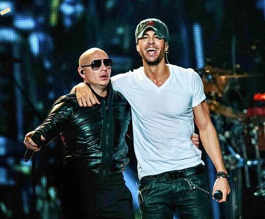 Latin heartthrob Enrique Iglesias and American rapper & Latin Grammy winning recording artist Pitbull take the stage at their sold-out Sex and Love Tour at the Staples Center where they had the audience dancing from the floor to the rafters. Los Angeles, CA. October 11, 2014.