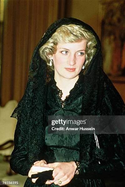 Diana, Princess of Wales, wearing a black lace dress designed by Catherine Walker and a mantilla veil to cover her hair, visits The Vatican on April...