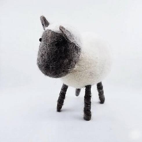 Handmade felt sheep made by Nepalese women and certified as 100% Fair Trade. Color: White. Size: 7.5"H
