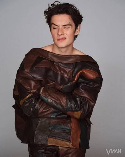 Louis Partridge wears a leather outfit by Prada for VMAN.