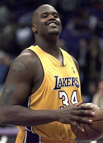 Shaquille O'Neal jokes around as he stands at the foul line during warmups at halftime of game against Toronto at Staples Center on Mar.7, 2001. 