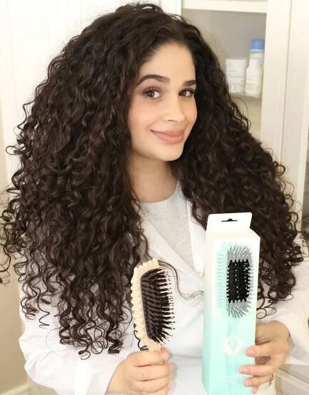 Bounce Curl Founder Holding Define EdgeLift Brush