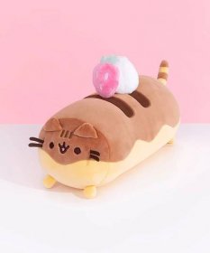 Front and side view of Pusheen Éclair Plush. Pusheen takes the form of a chocolate éclair treat. Her two-toned brown and yellow cylinder body is topped with a delicious pink strawberry and whipped cream dollop plush.