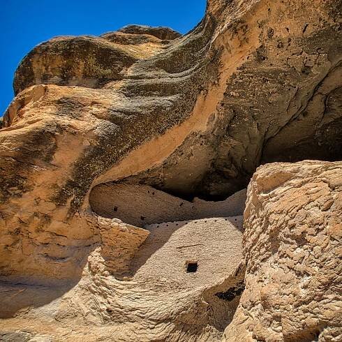 These beautifully crafted cliff-dwelling walls blend with the curves and structure of the country rock of the Gila Conglomerate.