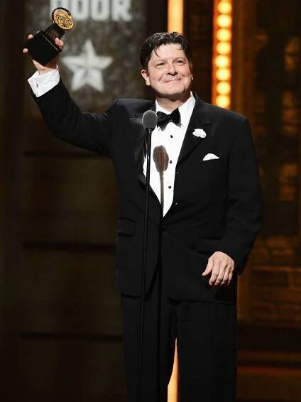 Michael McGrath accepts the award for Best Performance by a Featured Actor in a Musical onstage at the 66th Annual Tony Awards 