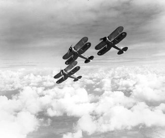 Three Gloster Gladiators flying