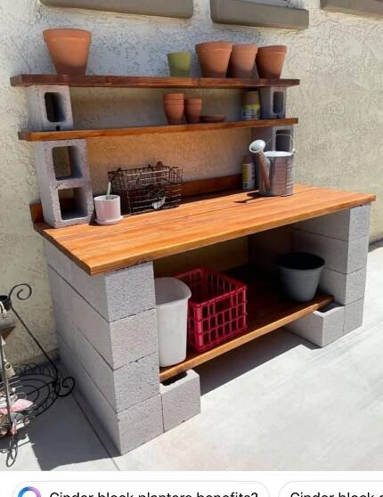 an outdoor kitchen made out of cinder blocks with pots and containers on the counter top