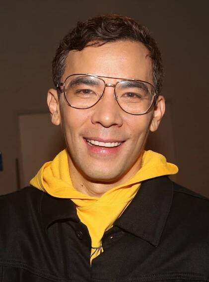 Close-up of Conrad Ricamora smiling