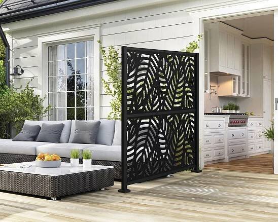 deck next to a kitchen with a screen and a sofa