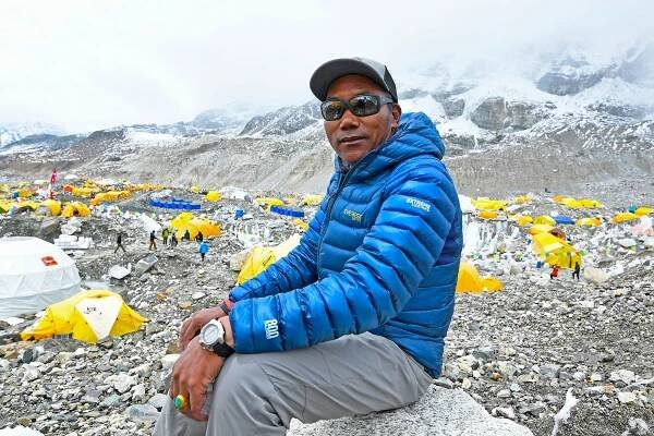 Nepali Sherpa breaks his own record again by scaling Everest 26 times, official says