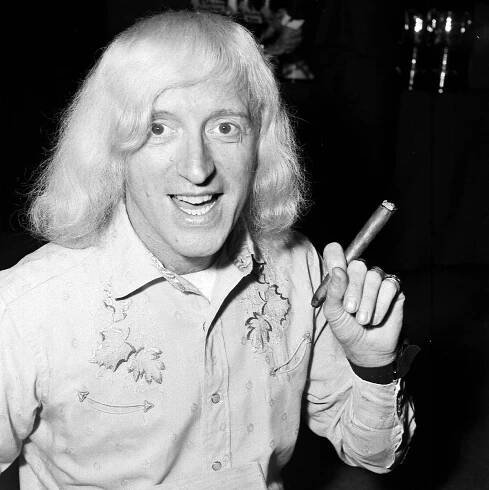 Image may contain Jimmy Savile Human Person Face and Finger