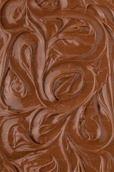 a close up of a chocolate cake with chocolate icing