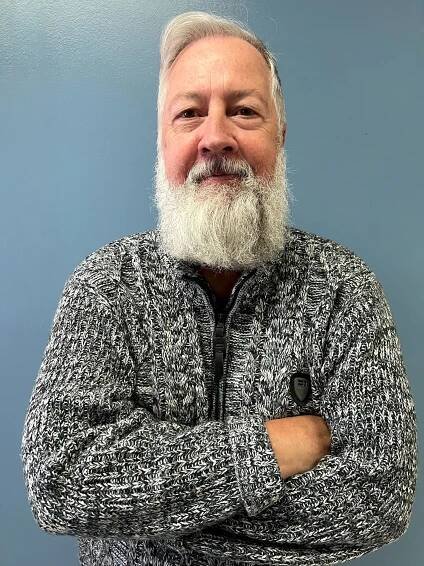 Image of Jeff Lord standing in front of plain background
