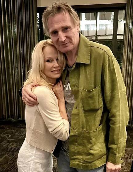 Pamela Anderson and Liam Neeson pictured embracing, dated June 2024 | Source: Instagram/chopslobsterbar