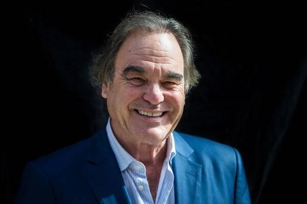 Oliver Stone smiling