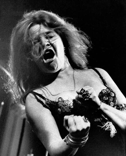 Blues/rock singer Janis Joplin performs at the Newport Folk Festival with her band Big Brother and the Holding Company