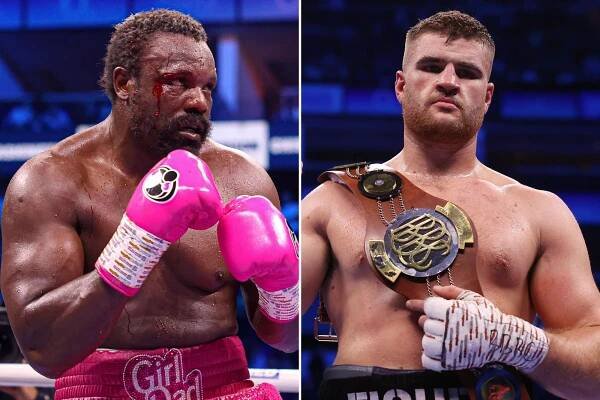 a man wearing pink boxing gloves stands next to another man