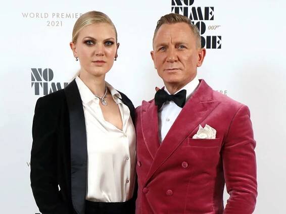 Daniel Craig and Ella Loudon, wearing Brunello Cuccinelli and Faberge at the World Premiere of "NO TIME TO DIE" at the Royal Albert Hall on September 28, 2021 in London, England