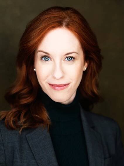 Elisabeth-Ness-Headshot-suit-eyebrow-raise-web
