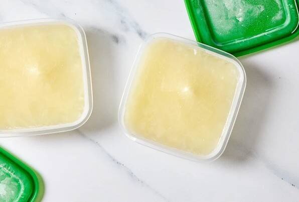 Frozen milk in plastic container