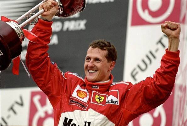 Michael Schumacher celebrating a Formula One World Championship win.