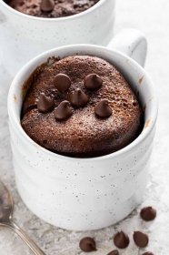 mug cake with chocolate chips placed on top
