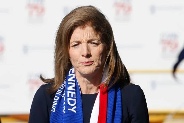 Caroline Kennedy with a red, white and blue scarf with writing 