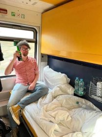 David sat on bunk of sleeper train — David Szmidt