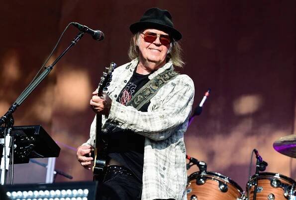 Neil Young performing on stage at Barclaycard Presents British Summer Time Hyde Park.