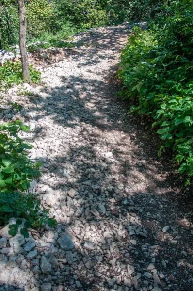 The rocky hiking path through the forest leading to the Tibetan Bridge - Crero, Lake Garda, Veneto, Italy - rossiwrites.com
