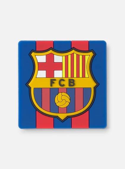 Close-up of the FC Barcelona crest on a blue and maroon striped background