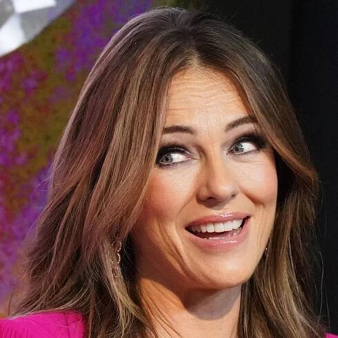 Elizabeth Hurley is the ultimate 'yummy mummy' as she poses in silky lingerie with baby son